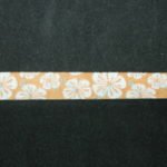 Nastro fantasia floreale giallo 12mm. Composizione 100% poliestere